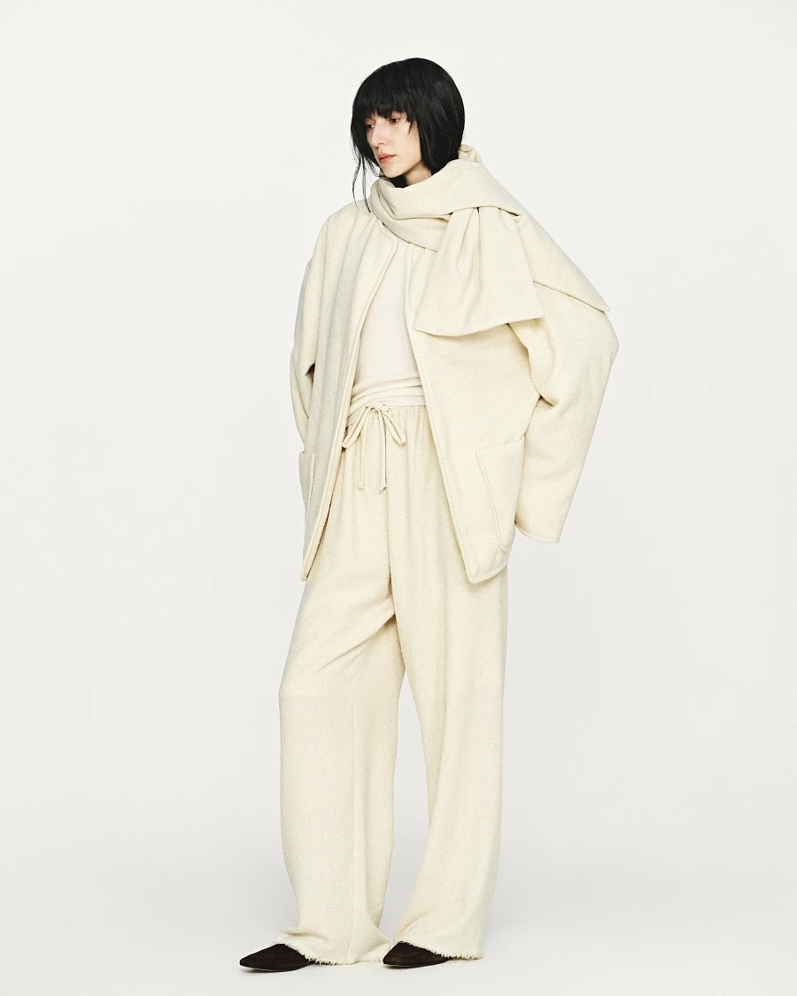 Ivory textured wool fringed straight pants